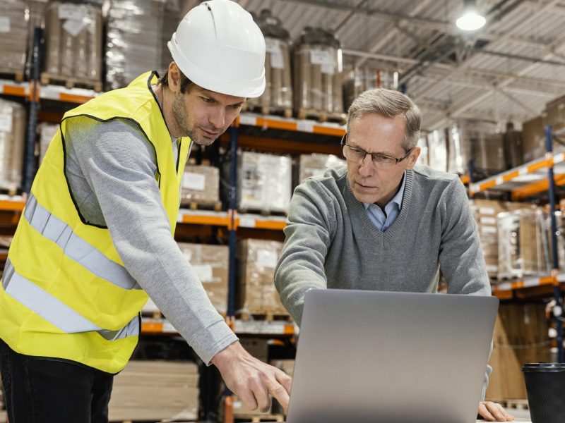 men-warehouse-working-laptop